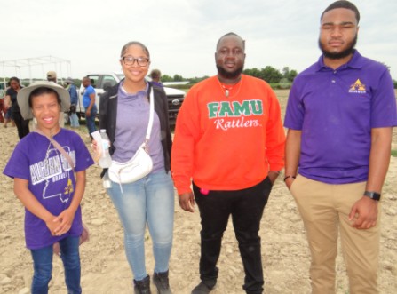 FAMU students stand in the field